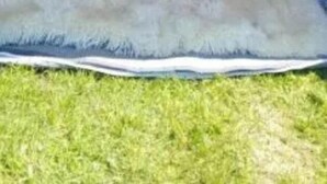 A tent with a sleeping area, including a bed with pillows and a fluffy rug. - 2-person Bell Tent Stay at Old Vicarage Campsite (Retford)