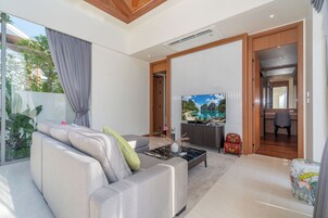 Villa, Non Smoking, Pool View | Living area | 55-inch flat-screen TV with digital channels