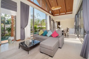 Villa, Non Smoking, Pool View | Living area | 55-inch flat-screen TV with digital channels