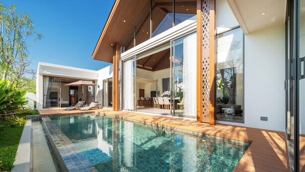 A modern house with a swimming pool, large glass doors, and a patio area. - Ozone Sanctuary 3BR Private Pool Villa (Choeng Thale)