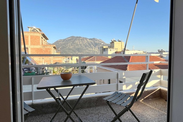 Sunny balcony with stunning city and mountain views