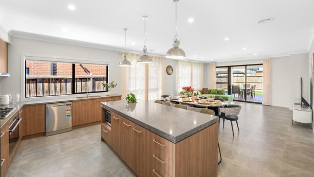 A modern kitchen with a central island, pendant lighting, and a view of the outside. - Park-fronted Luxury Grand Family House with Gym, Heated Pool/Spa, Tennis Court. (Mambourin)