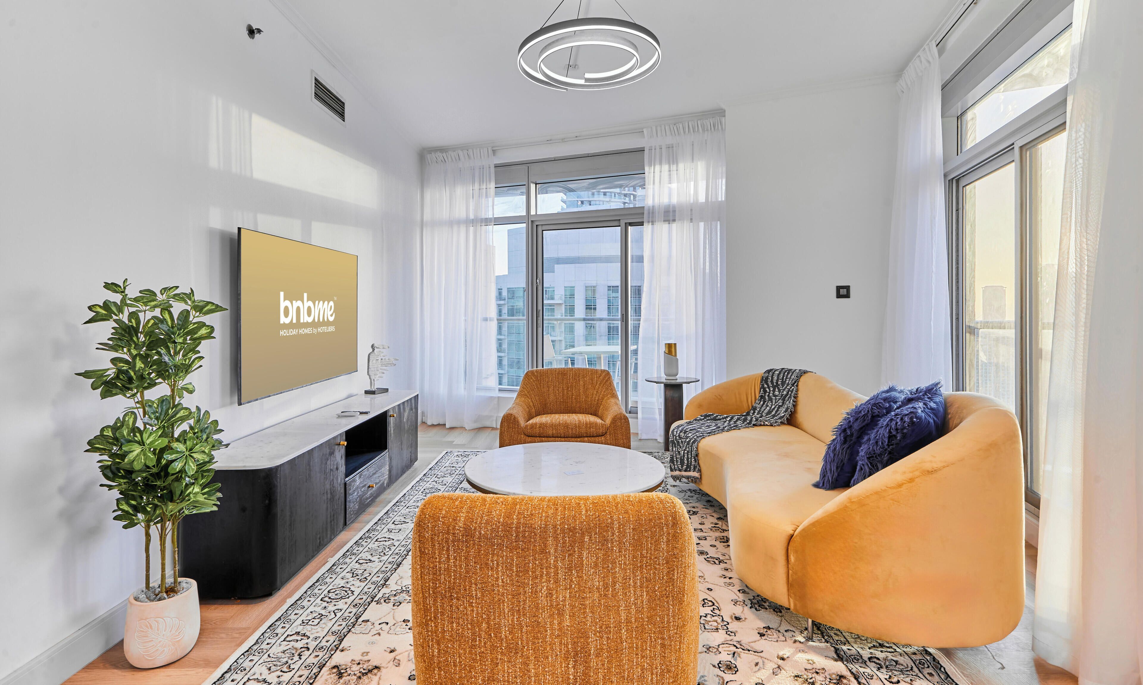 Premium Apartment, City View | Living area | 65-inch flat-screen TV with cable channels
