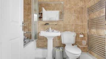 Combined shower/bathtub, deep-soaking bathtub, hair dryer, towels