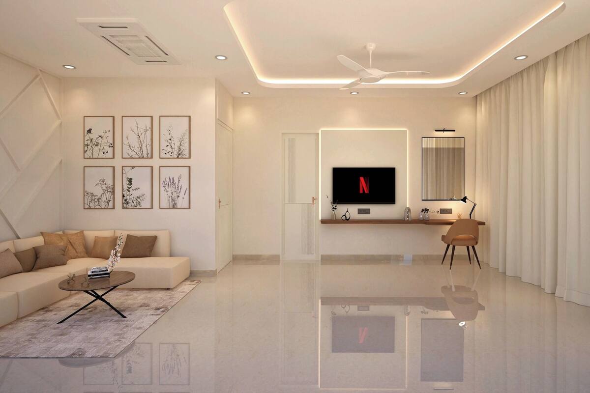 Una sala de estar moderna con sofá, mesa de centro, televisor y obras de arte.