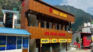A two-story building with a sign reading 'Hotel Shrim Hari & Restaurant.' - Hotel Shri Hari And Restaurant (Ukhimath)