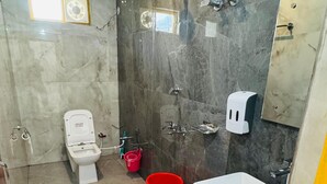 A bathroom with a toilet, bidet, shower, and sink. - Hotel Shri Hari And Restaurant (Ukhimath)