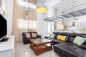 A modern living room with a sofa, coffee table, and a television. - HOUSE SOL TIJOCO. ADEJE (Adeje)