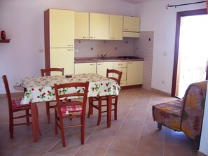 Dining - Sea View Isola Rossa Apartment with Sea View, Wi-Fi, and Air Conditioning (Paduledda)