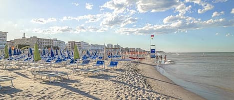 Private beach, white sand, sun loungers, beach umbrellas