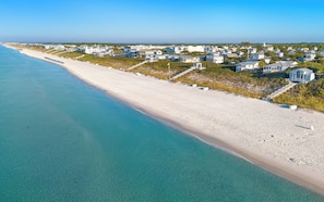 A coastal area with a beach, houses, and a clear view of the ocean. - The Poppy House + Seaside, Pet Friendly & Bikes (Santa Rosa Beach)