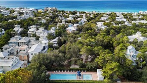 A coastal residential area with houses, a swimming pool, and a view of the ocean. - The Poppy House + Seaside, Pet Friendly & Bikes (Santa Rosa Beach)