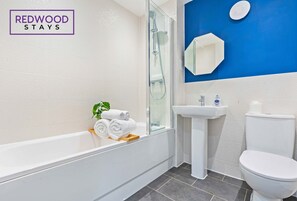 Shower, hair dryer, towels, shampoo