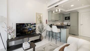 Standard Apartment, Balcony | Living area | 42-inch Smart TV with satellite channels, Netflix, streaming services