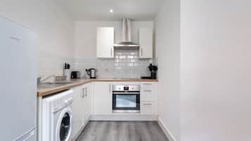 Fridge, electric kettle, toaster, cookware/dishes/utensils