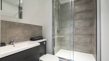 Shower, towels, toilet paper