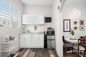 Fridge, microwave, stovetop, coffee/tea maker