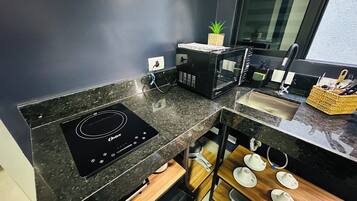 Mini-fridge, microwave, stovetop, cookware/dishes/utensils