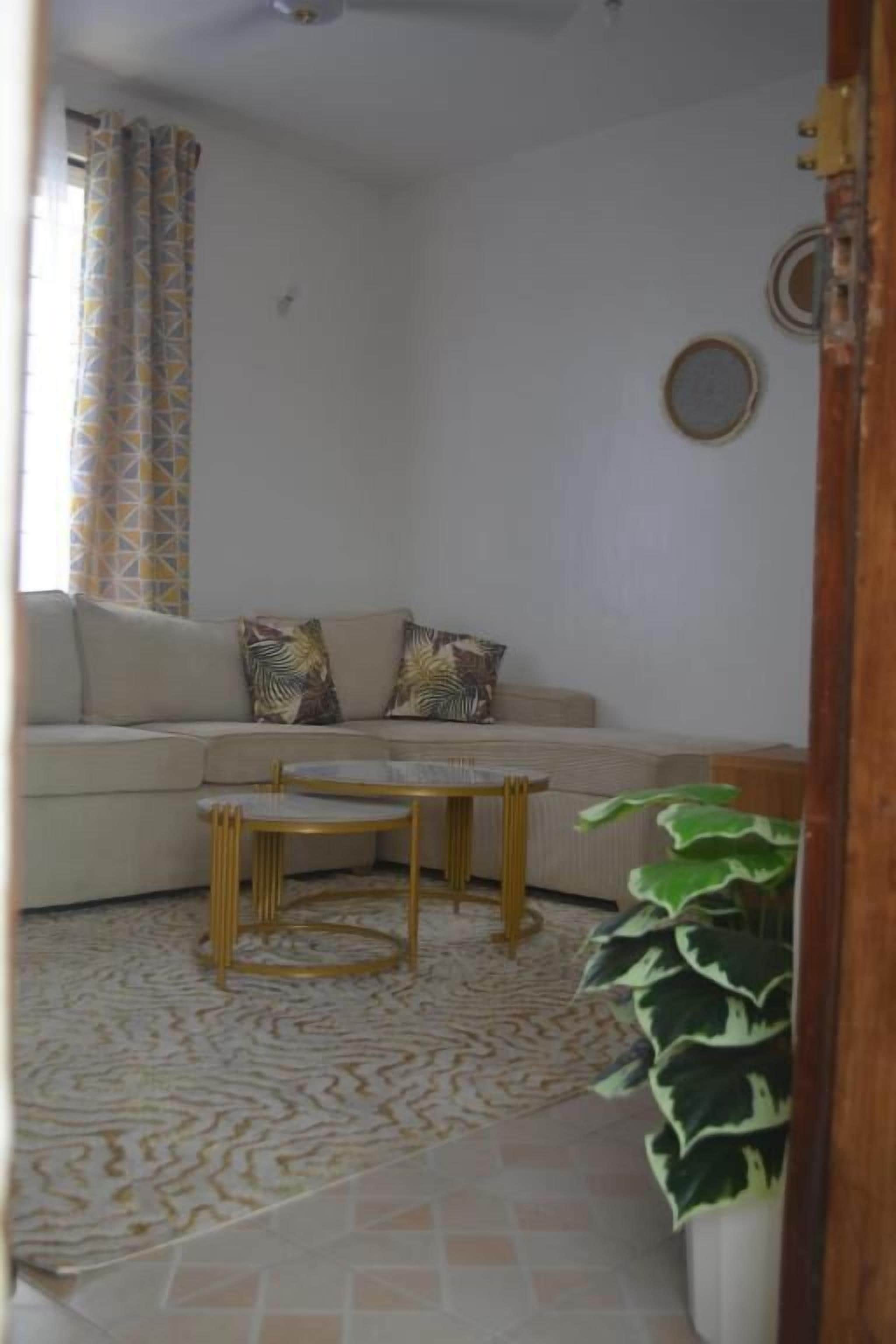Deluxe Apartment | Living area | 32-inch Smart TV with digital channels