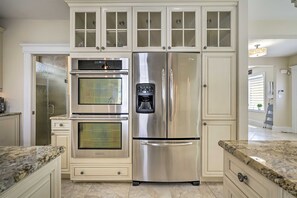 A kitchen with a stainless steel refrigerator, double oven, and a built-in coffee maker. - Family Beach Getaway 1 block to Beach & Boardwalk (Ventnor City)