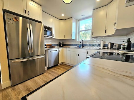 Private kitchen. Stylish Lakewood 2 bed w/ West Facing Balcony