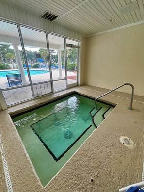 A swimming pool with a clear view of the outside.