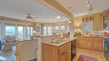 Dishwasher, coffee/tea maker, cookware/dishes/utensils, dining tables