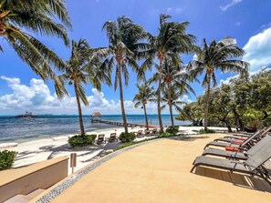 On the beach, sun-loungers - Island Condo 403 Oceanfront Puerta al Mar in Sac Bajo (isla mujeres)