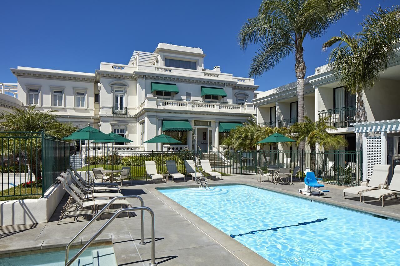 Dive into sunshine and lounge poolside under swaying palms.
