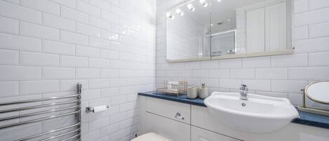 Hair dryer, towels, soap, toilet paper