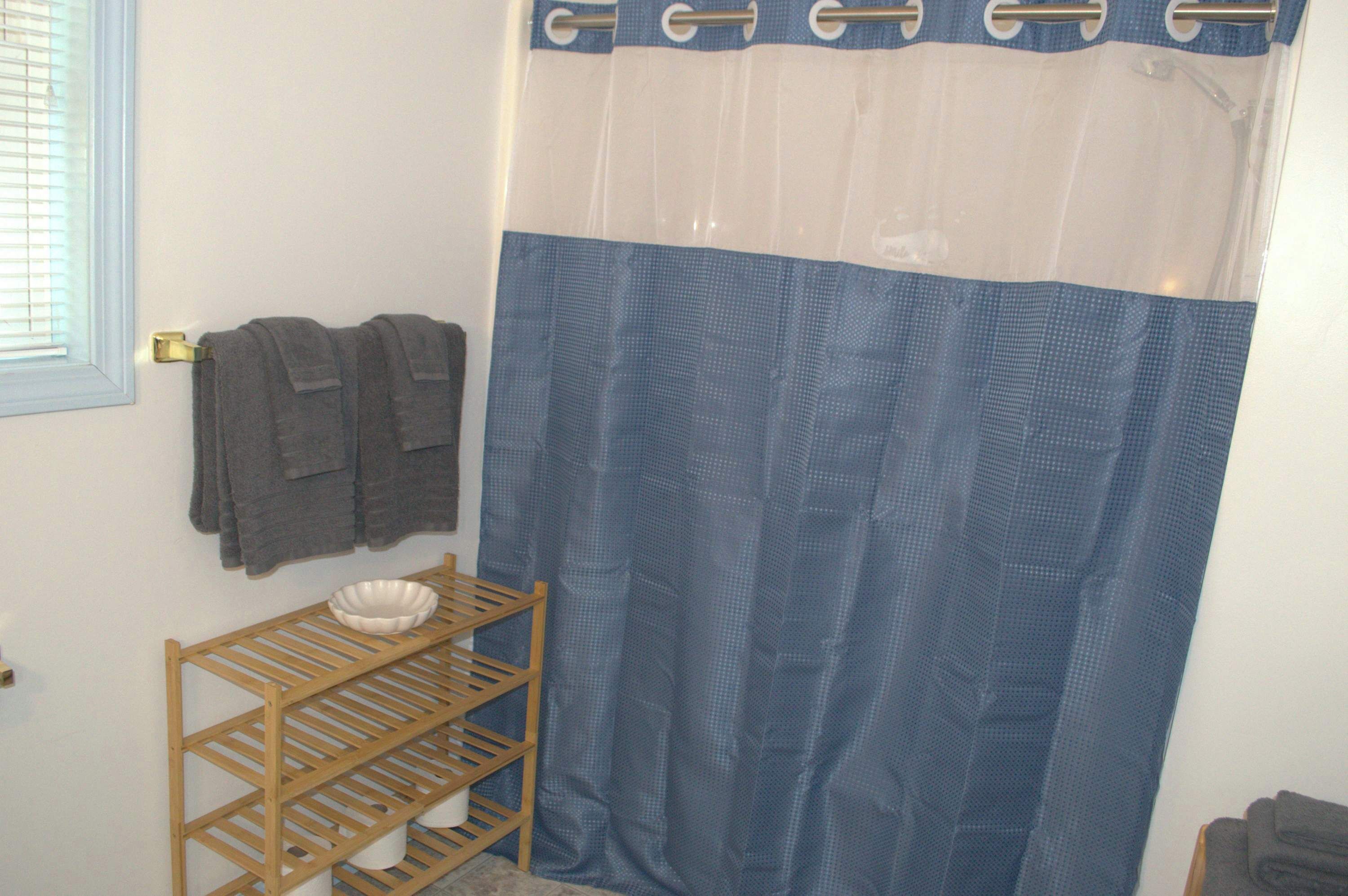Shower, hair dryer, towels, shampoo