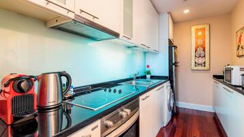 Fridge, microwave, stovetop, coffee/tea maker