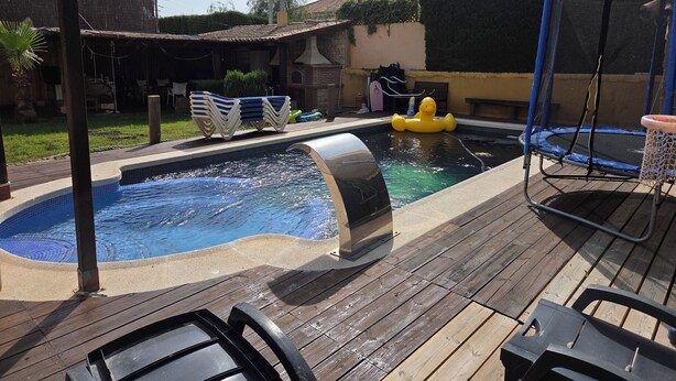 A swimming pool with a hot tub, a trampoline, and a wooden deck. - Luxury villa in la manga (Playa Honda)