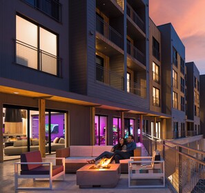 A modern building with multiple balconies, outdoor seating areas, and a fire feature. - Canyon Haus 129 | Deluxe Studio | Valley View | Heated Pool | Hot Tub (Park City)