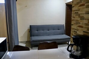 Chambre Deluxe | Coin séjour