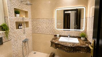 Bidet, towels, soap, toilet paper