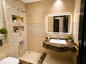 Bidet, towels, soap, toilet paper