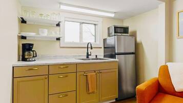 Fridge, microwave, coffee/tea maker, cookware/dishes/utensils
