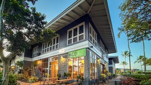 A building with a sign reading "KICO" and "VICOLO". - Paradise Awaits at This Beautiful Waikoloa Village Condo! (Waikoloa Village)