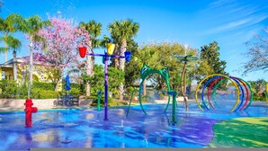 A water play area with colorful structures and a red fire hydrant. - Go 13 - Bahama BAY in Davenport (Davenport)