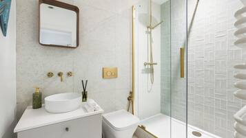 Shower, hair dryer, towels, soap