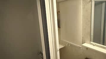 Shower, hair dryer, towels, toilet paper