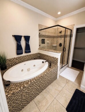 Shower, jetted tub, towels, soap