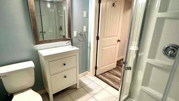 Shower, towels, soap, toilet paper