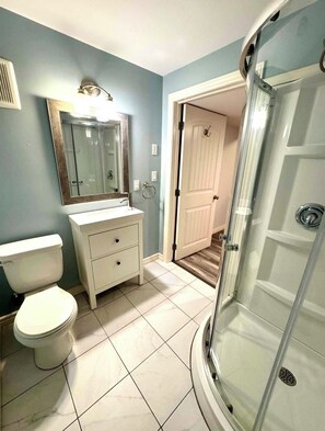 Shower, towels, soap, toilet paper