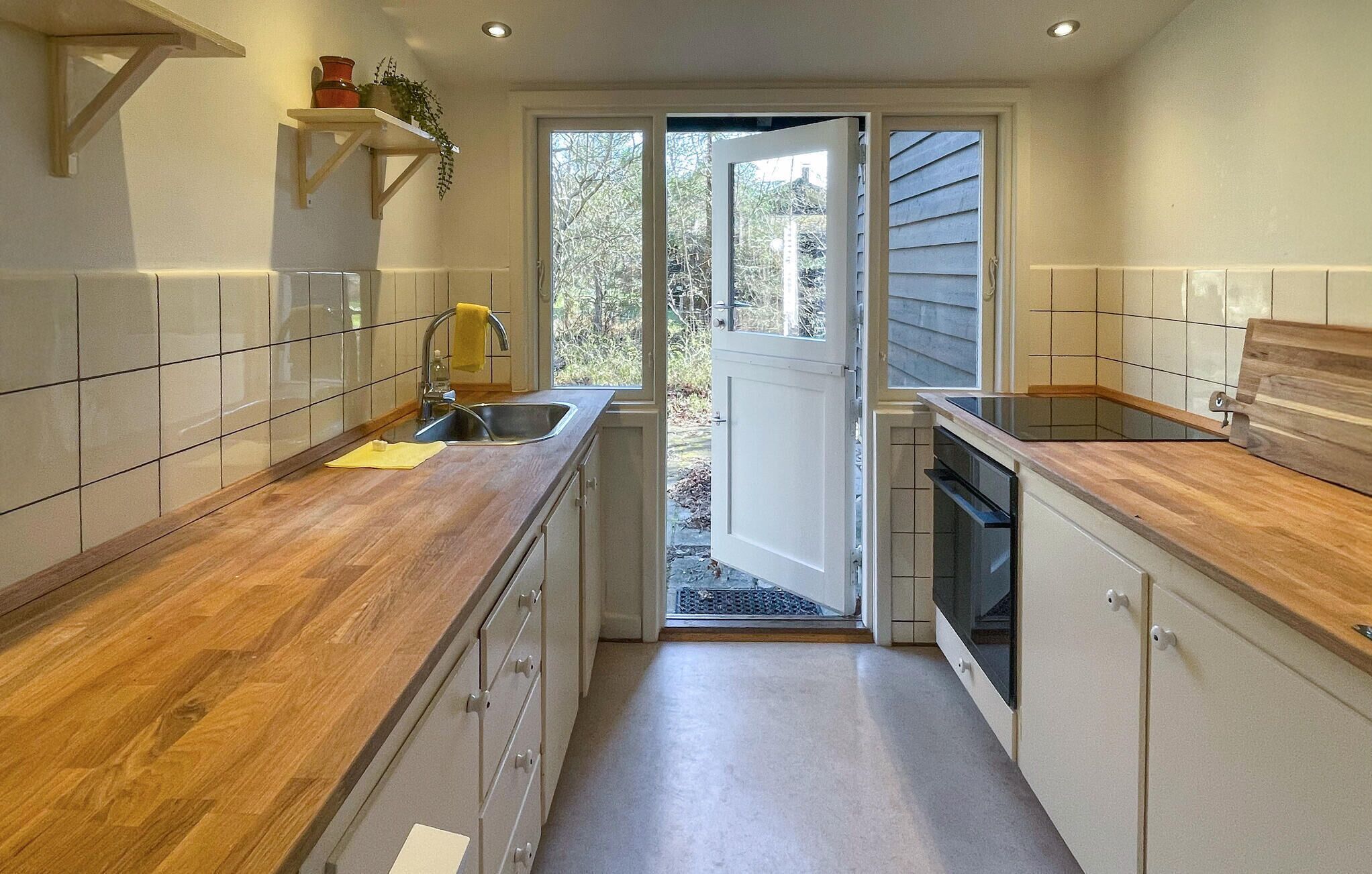 Fridge, dishwasher, coffee/tea maker, cookware/dishes/utensils