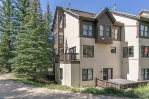 A multi-story building with a balcony, a door, and a window. - Offerson Chalet in Beaver Creek (Beaver Creek)