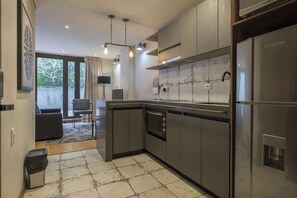 Apartment, 1 Queen Bed, Patio, City View (La Primera 107) | Private kitchen - NOK Amazing 1 Br in Candelaria (Bogotá)