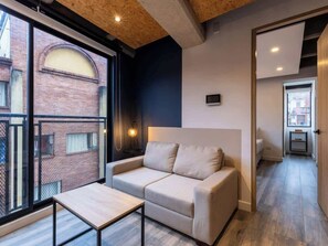 Apartment, 1 Queen Bed, Patio, City View (Mambe 402) | Living area - NOK Incredible 1 BR in Chapinero (Bogotá)