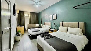 A hotel room with two beds, a ceiling fan, a large window with curtains, a potted plant, and a flat-screen TV. - Jazz & Stay (Guadalajara)
